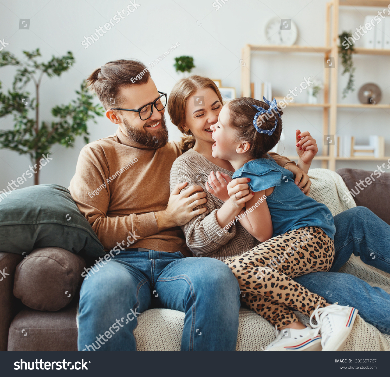 happy family mother father and child daughter laughing and havig fun at home  
 #1399557767
