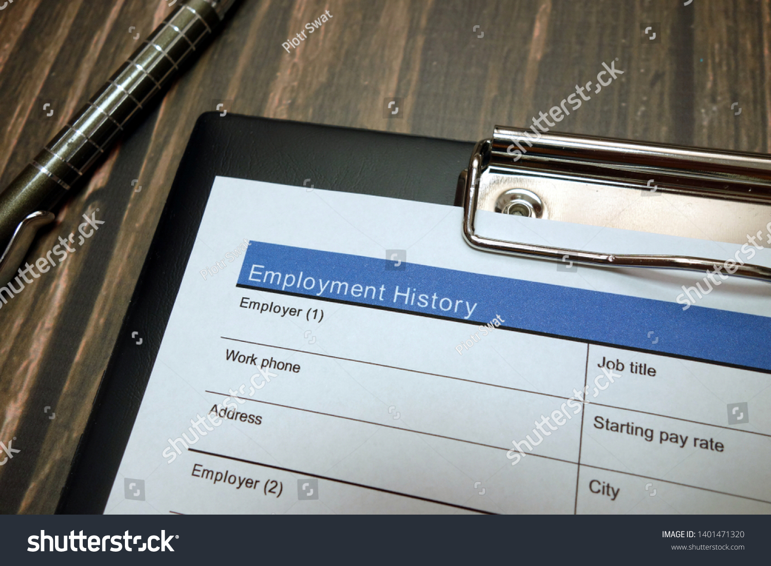 Clipboard with employment history document, job application form #1401471320
