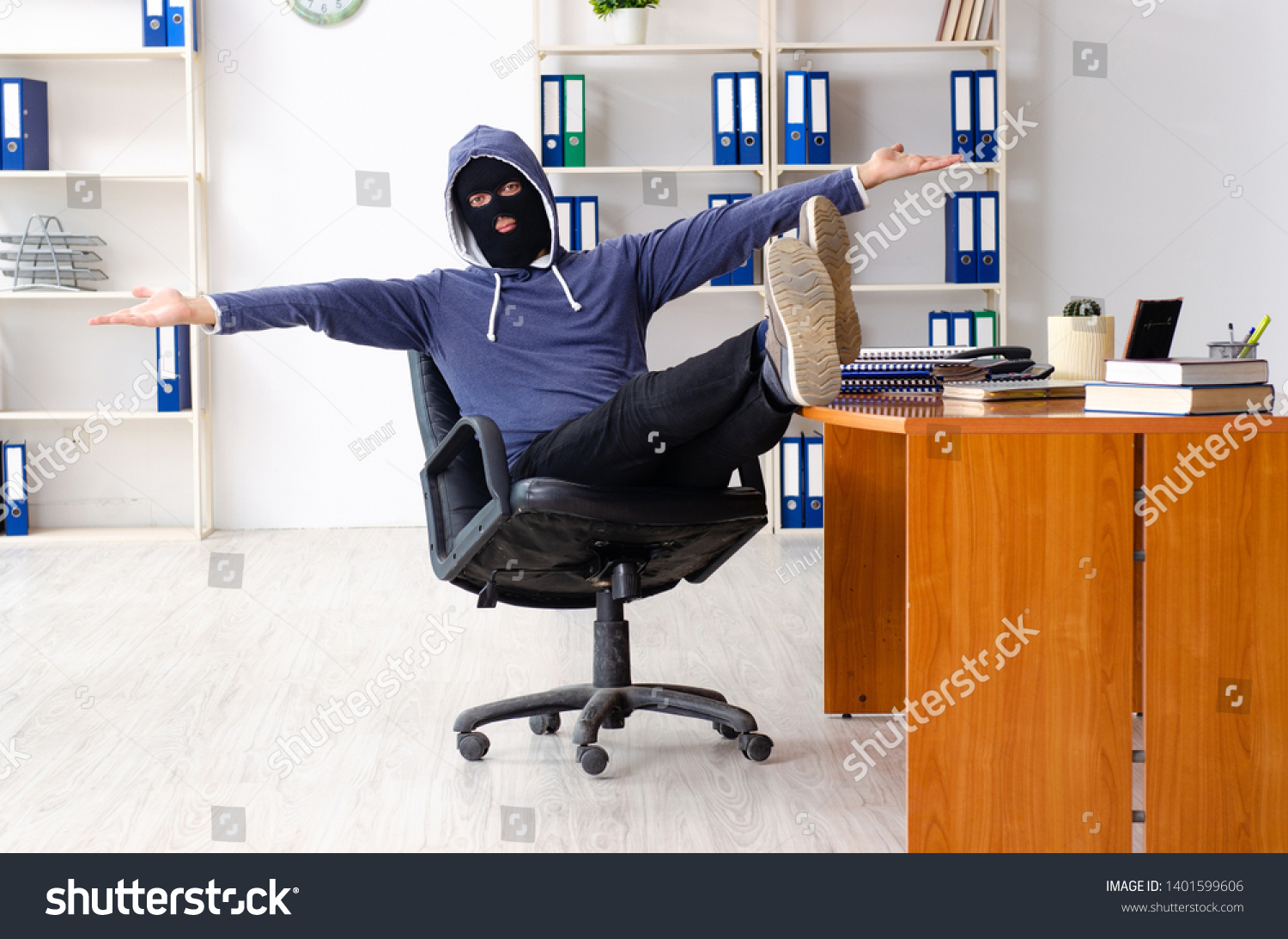 Male thief in balaclava in the office  #1401599606