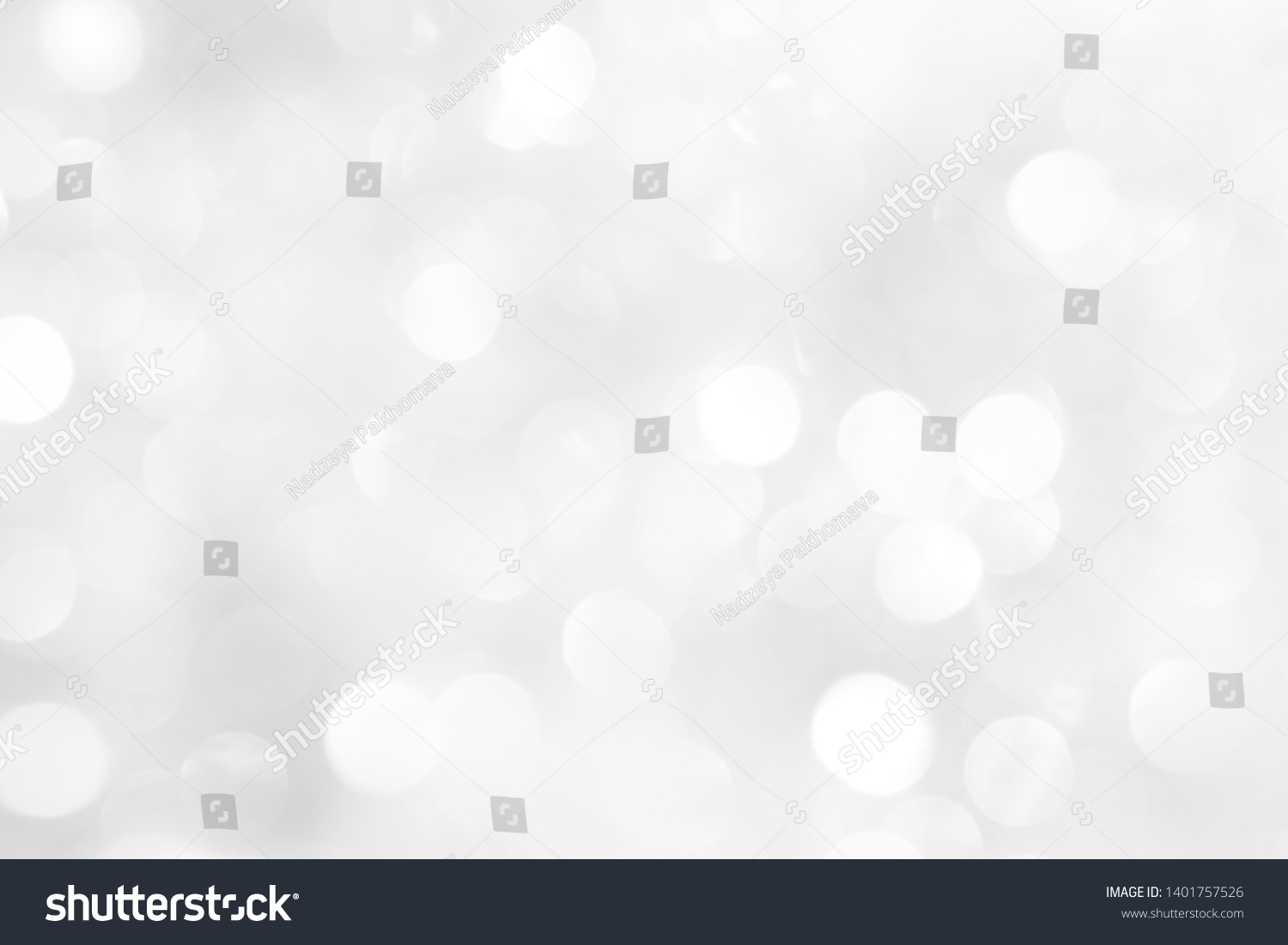 A brilliant white background with circles and ovals. Template for a holiday card with bright and sparkling lights. #1401757526