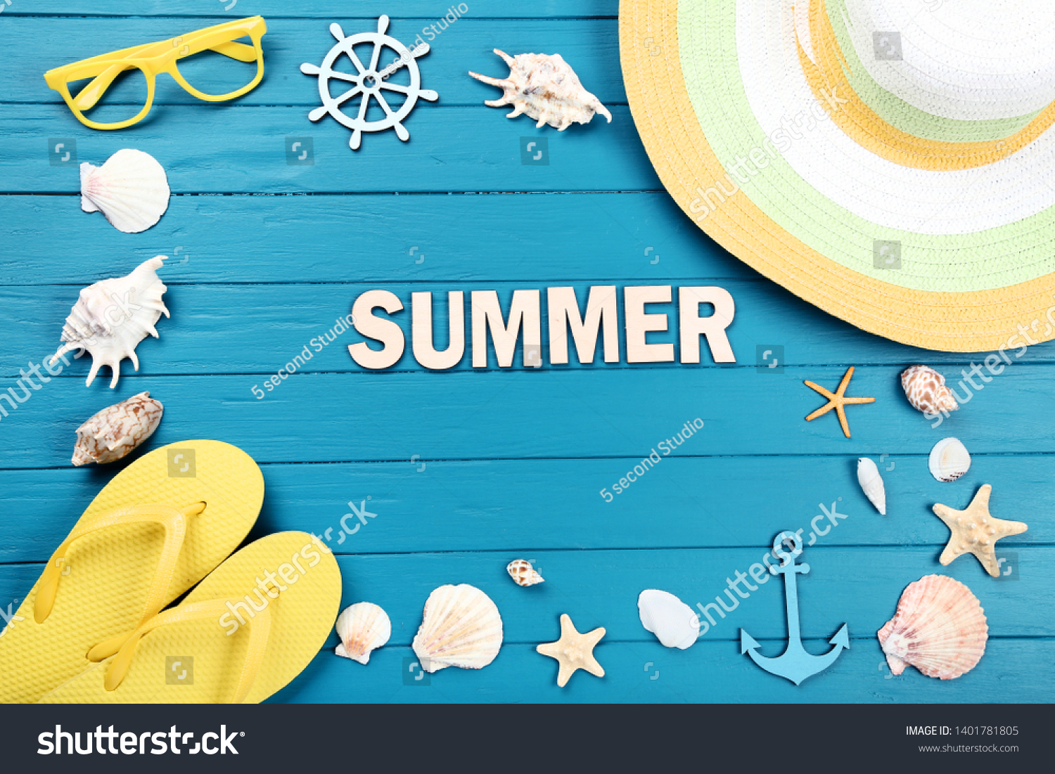 Word Summer with seashells and clothing on blue wooden table #1401781805