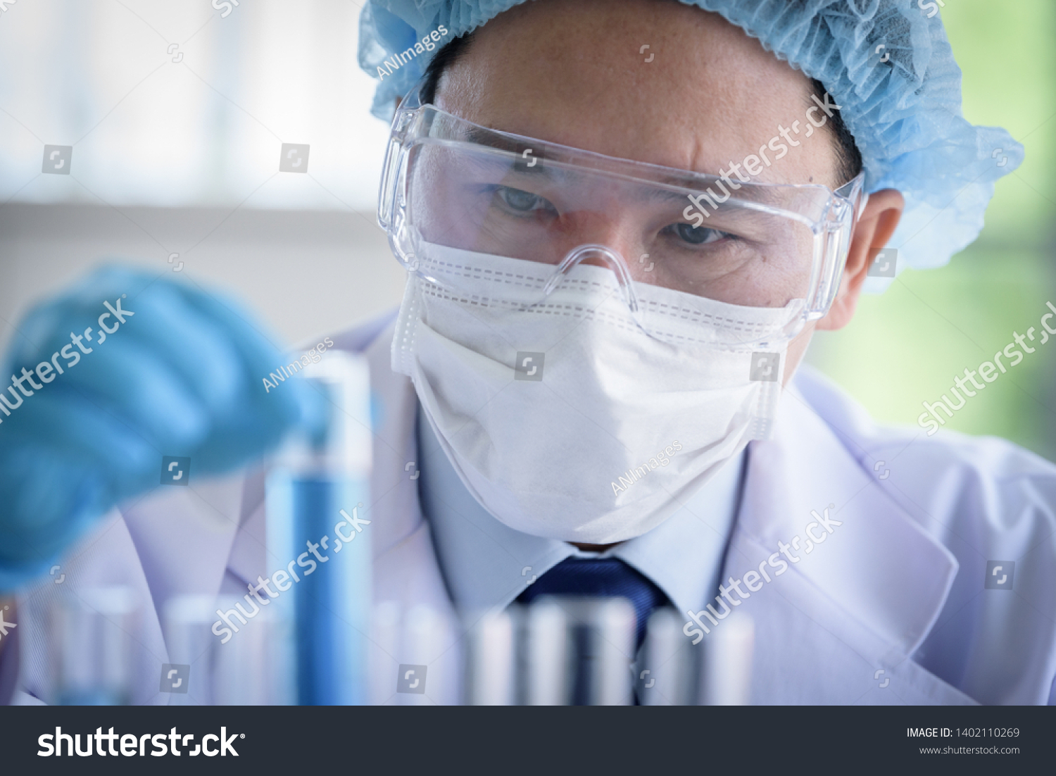 Asian man scientist researching  and learning in a laboratory. #1402110269