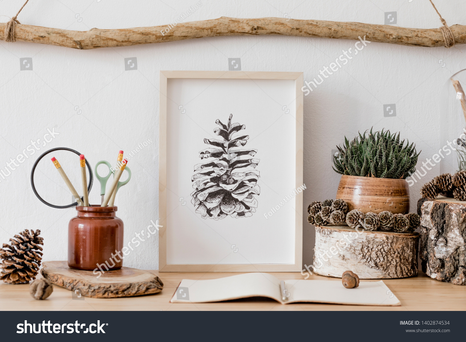 Stylish and scandinavian interior of living room with mock up poster frame, wooden accessories, succulents, forest cones, plants, notes and personal stuff. Minimalistic and botanical home decor.  #1402874534