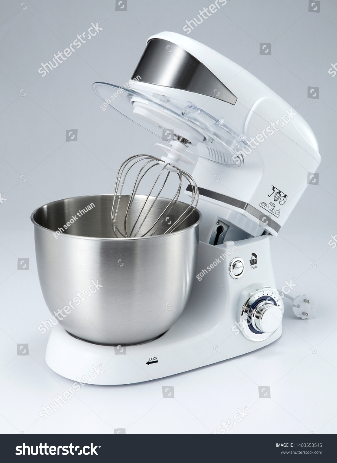 A mixer, hand mixer or stand mixer, is a kitchen device that uses a gear-driven mechanism to rotate a set of "beaters" in a bowl containing the food or liquids to be prepared by mixing them. #1403553545