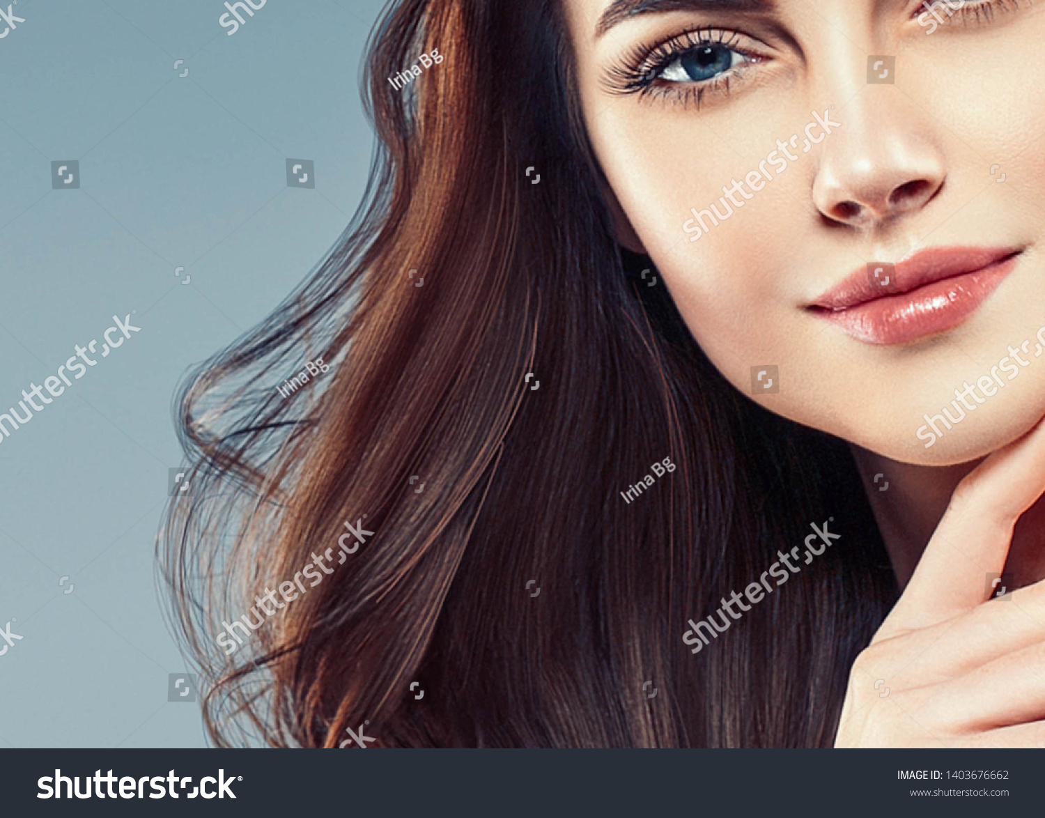Beautiful woman face closeup with beauty makeup and brunette hair closeup #1403676662