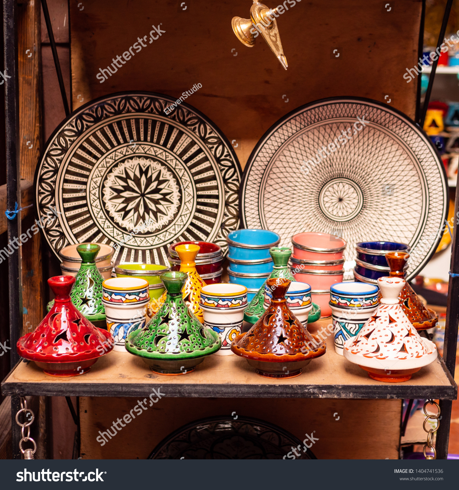 Traditional Moroccan marrakech market with plates and tajin tagine. Handmade ceramic plates. Arabian colorful ramadan design #1404741536