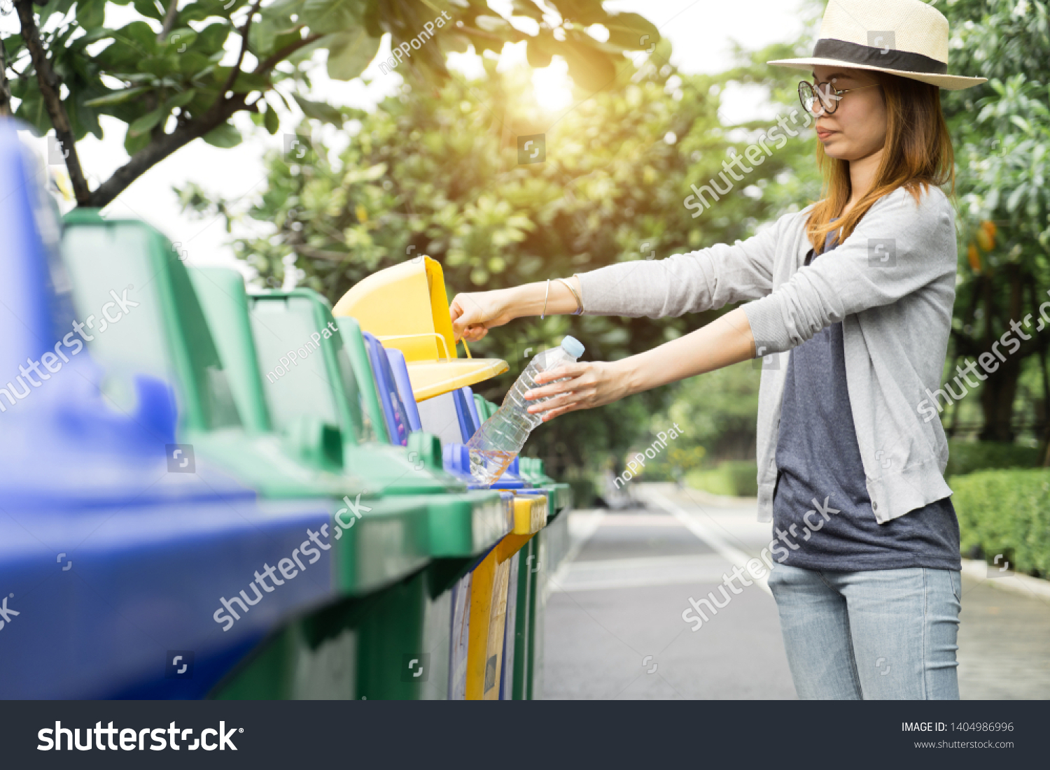 Recycle rubbish waste management people, Woman separate plastic bottle to container recycle bin. Waste separation rubbish to garbage bin, environment care pollution trash recycling management concept. #1404986996