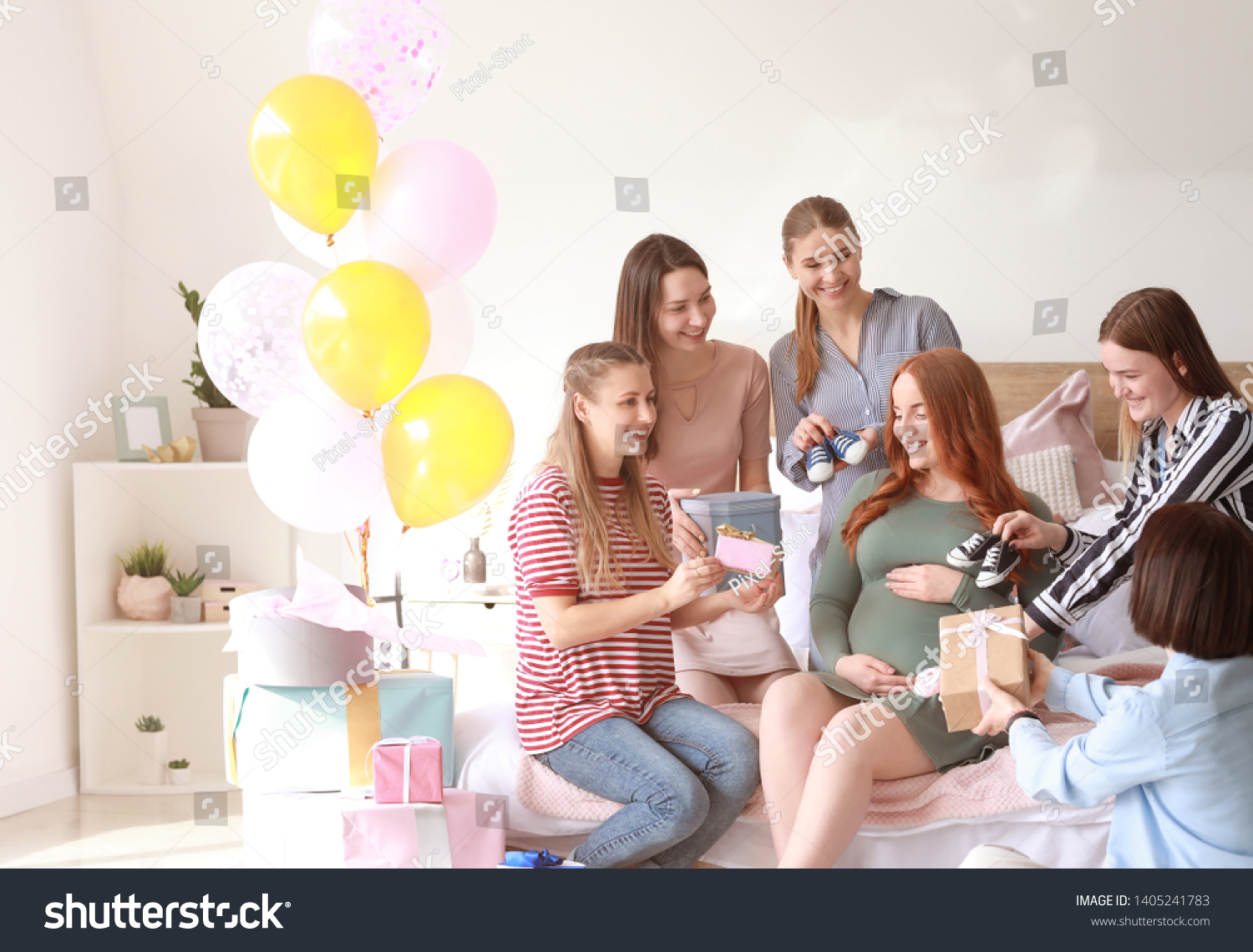 Beautiful pregnant woman and her friends at baby shower party #1405241783