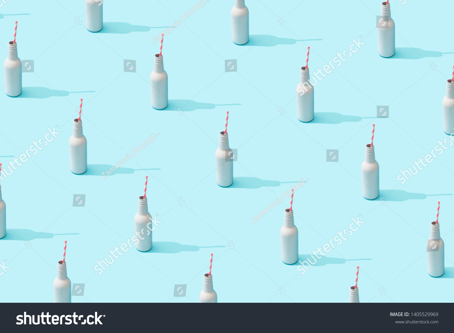 Trendy sunlight Summer pattern made with white bottle  on bright light blue background. Minimal summer concept. #1405529969