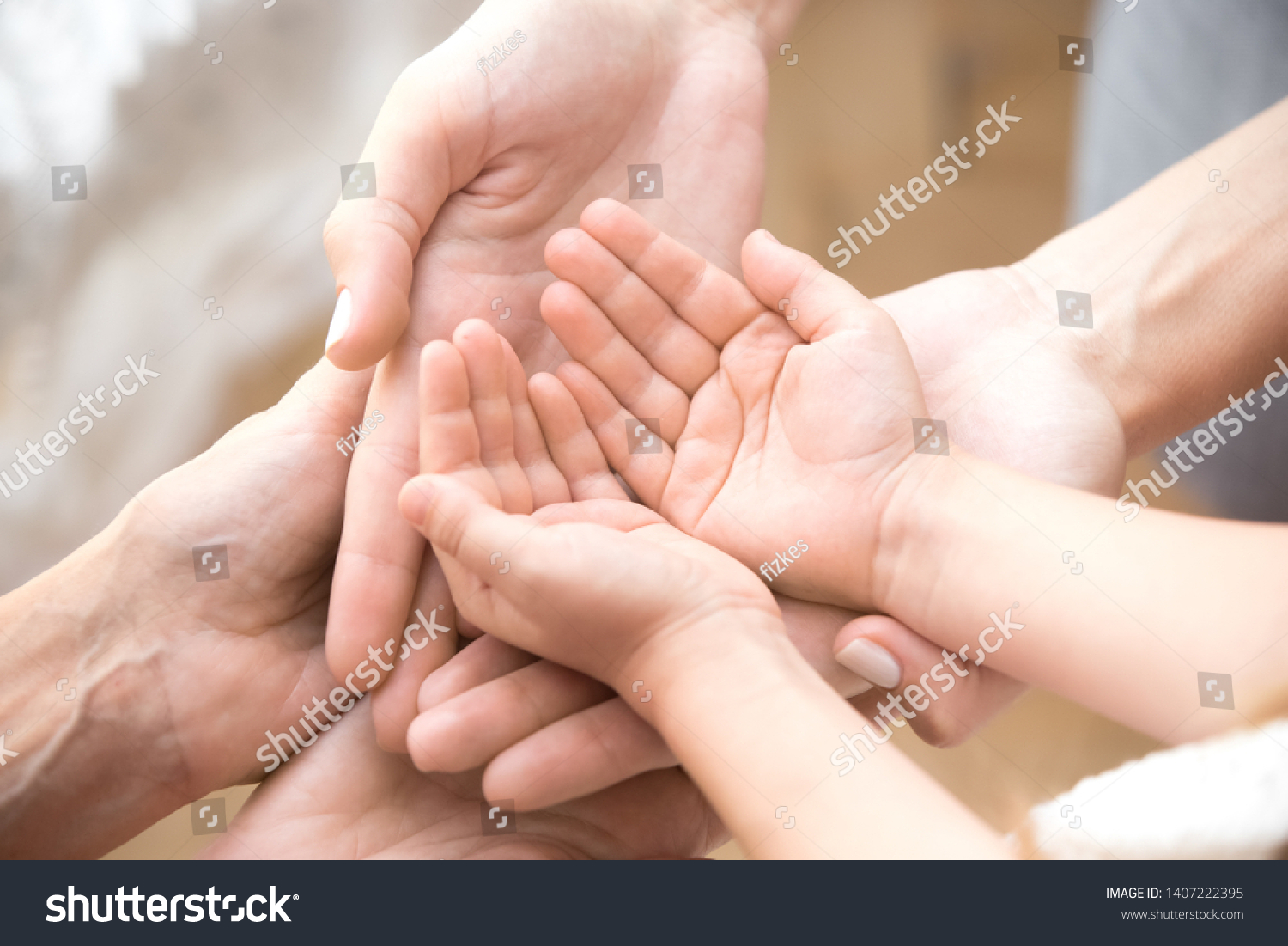 Close up of three caucasian person stack their palms. Grandmother mother and granddaughter holding their hands together. Gesture sign of support and love, unity togetherness relative people concept #1407222395