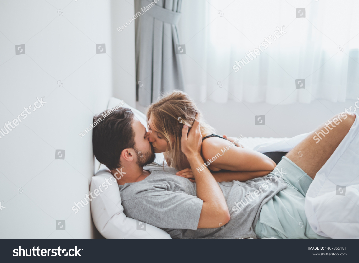 Happy Couple Lover On Bed Hug And Kiss In Royalty Free Stock Photo 1407865181 Avopix Com