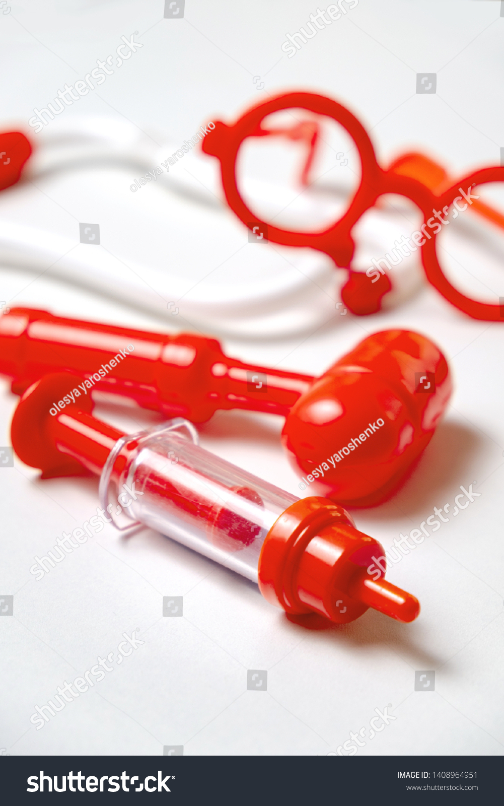 Toy medical devices on a white background.  Kids playing profession doctor. Choice of profession #1408964951