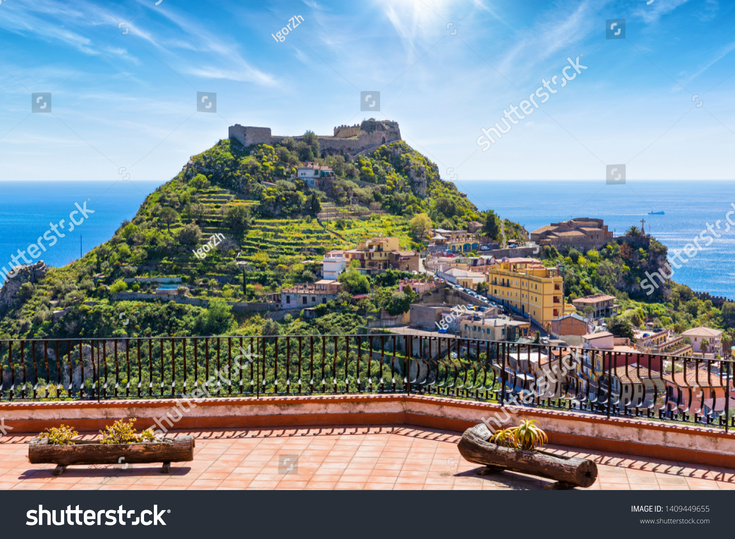 Taormina Castle, known as Castello di Taormina or Castello Saraceno, and little church of Madonna della Rocca located on green mount in Messina province on Sicily island in Italy.   #1409449655