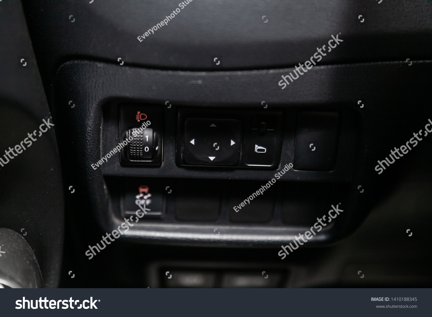 Novosibirsk, Russia - May 28, 2019:  Nissan Juke, close-up of the  buttons: side mirror  and headlight adjustment buttons. Photography of a modern car on a parking in Novosibirsk
 #1410188345