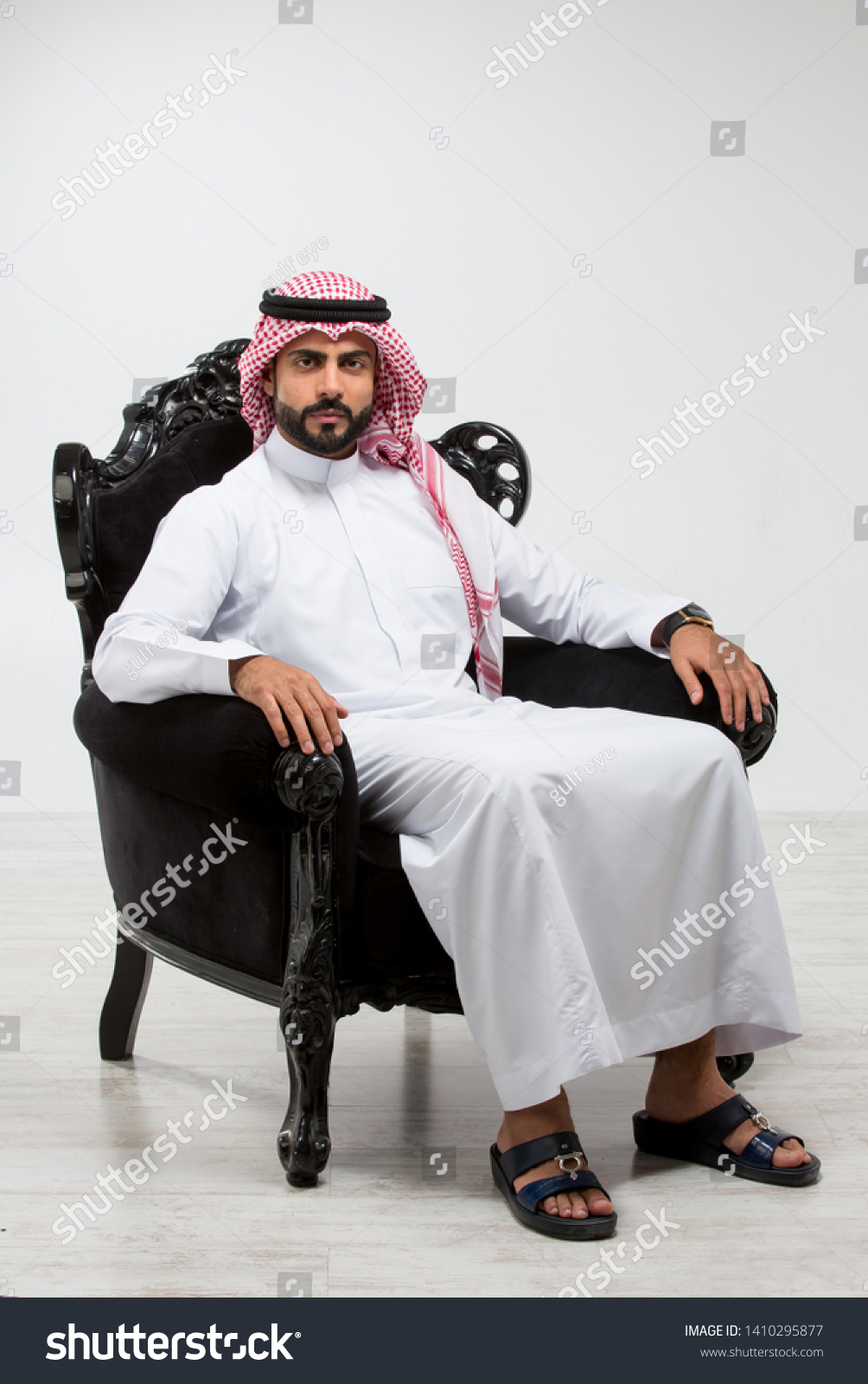 Portrait of an arab man sitting down. #1410295877