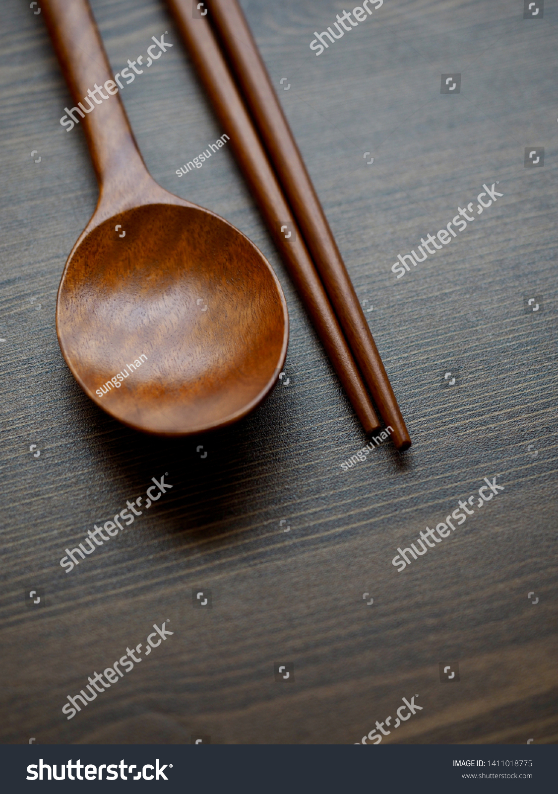 Wooden spoon, Wooden chopsticks and Wooden board background
 #1411018775