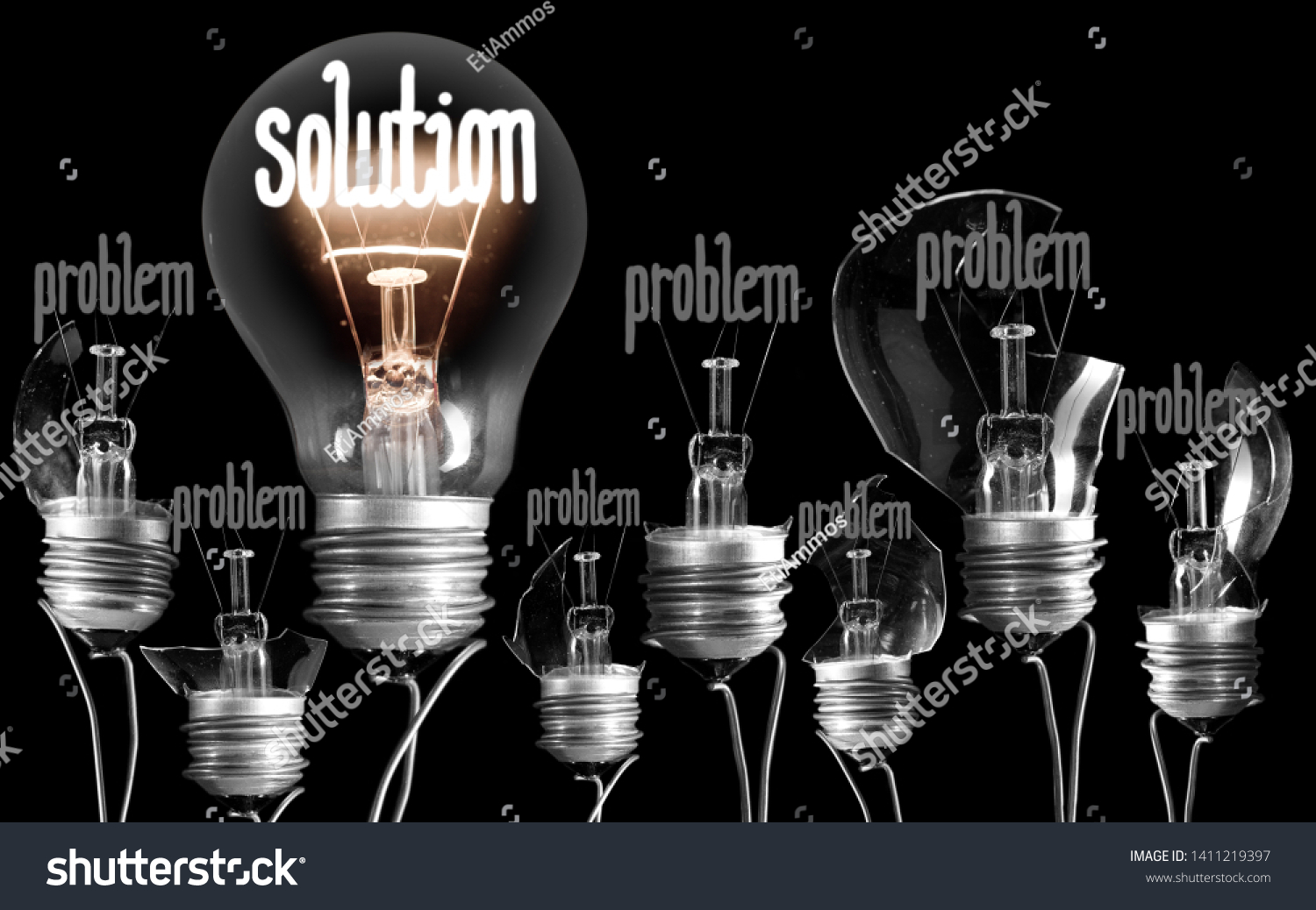 Photo of light bulbs with shining fibers in a shape of PROBLEM and SOLUTION concept isolated on black background #1411219397