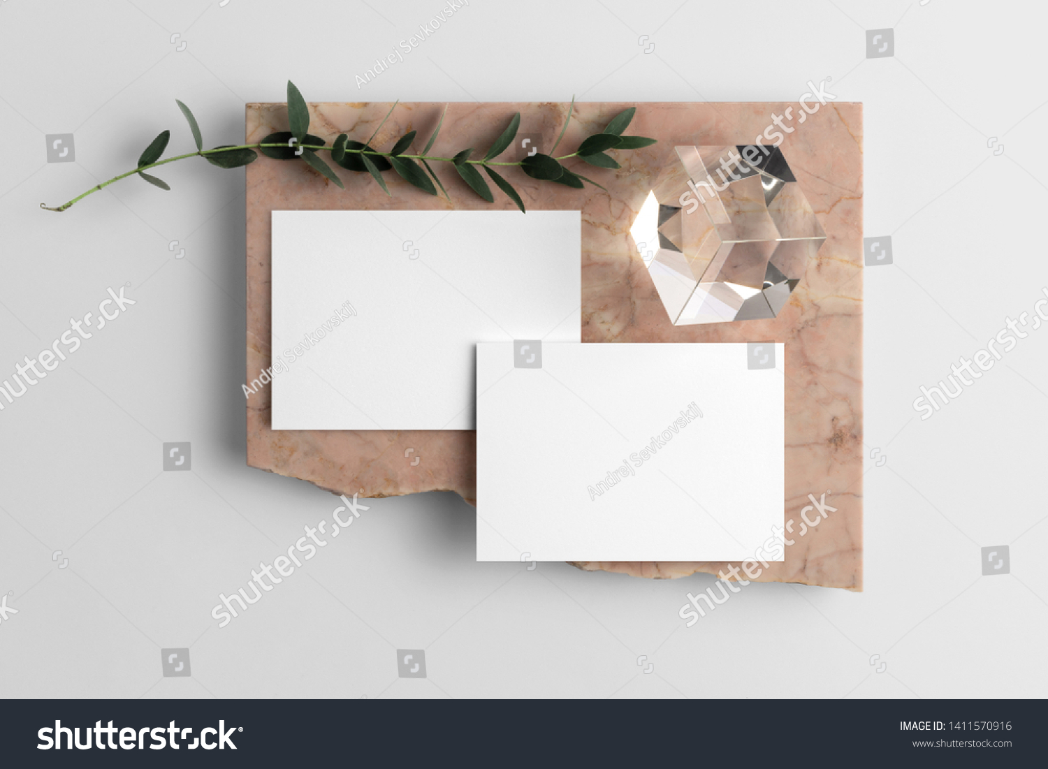 Real photo, business cards branding mockup template, isolated on light grey background, with marble and floral elements to place your design. #1411570916
