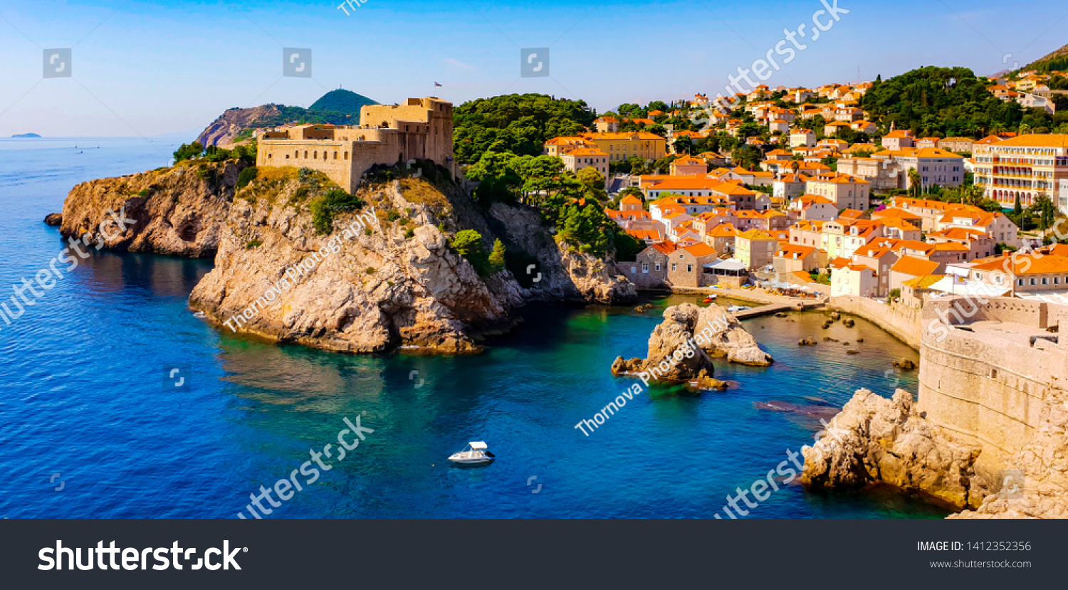 Amazing view on the Adriatic sea from the fortress walls of Dubrovnik, Croatia, with its historical old town, on a sunny summer day  #1412352356
