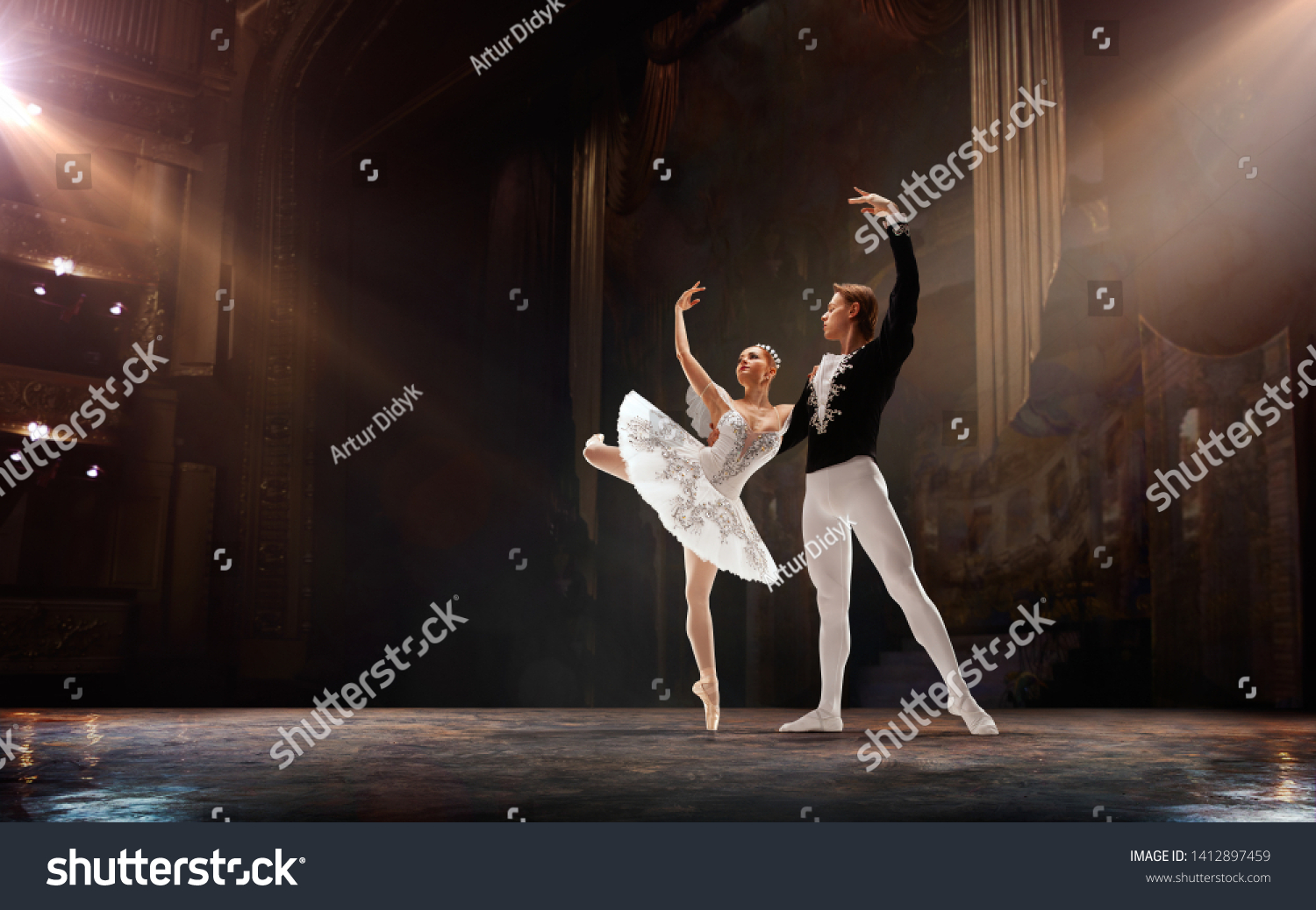 Ballet. Classical ballet performed by a couple of ballet dancers on the stage of the opera house. #1412897459