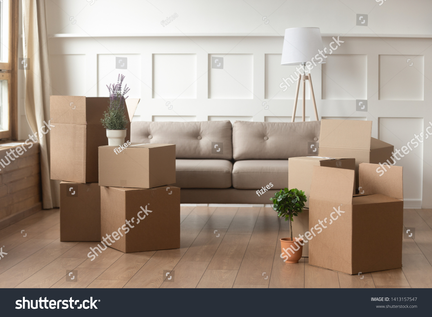 Moving day concept, cardboard carton boxes stack with household belongings in modern house living room, packed containers on floor in new home, relocation, renovation, removals and delivery service #1413157547