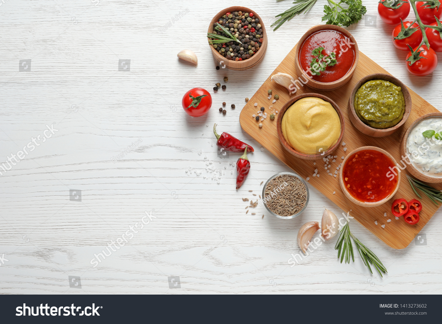 Flat lay composition with different sauces and space for text on white wooden background #1413273602