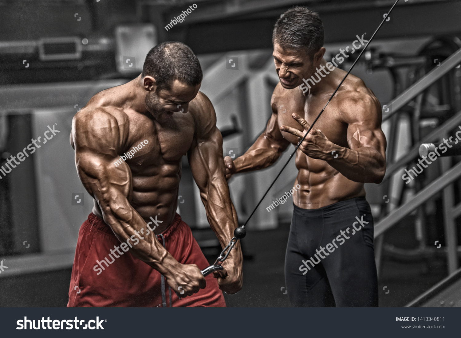 Bodybuilding Motivation. Two Bodybuilders Train Together at the Gym #1413340811