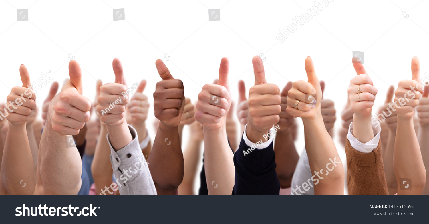 Close-up Of People's Hand Showing Thumb Up Sign Against Isolated On White  Background #1413515696