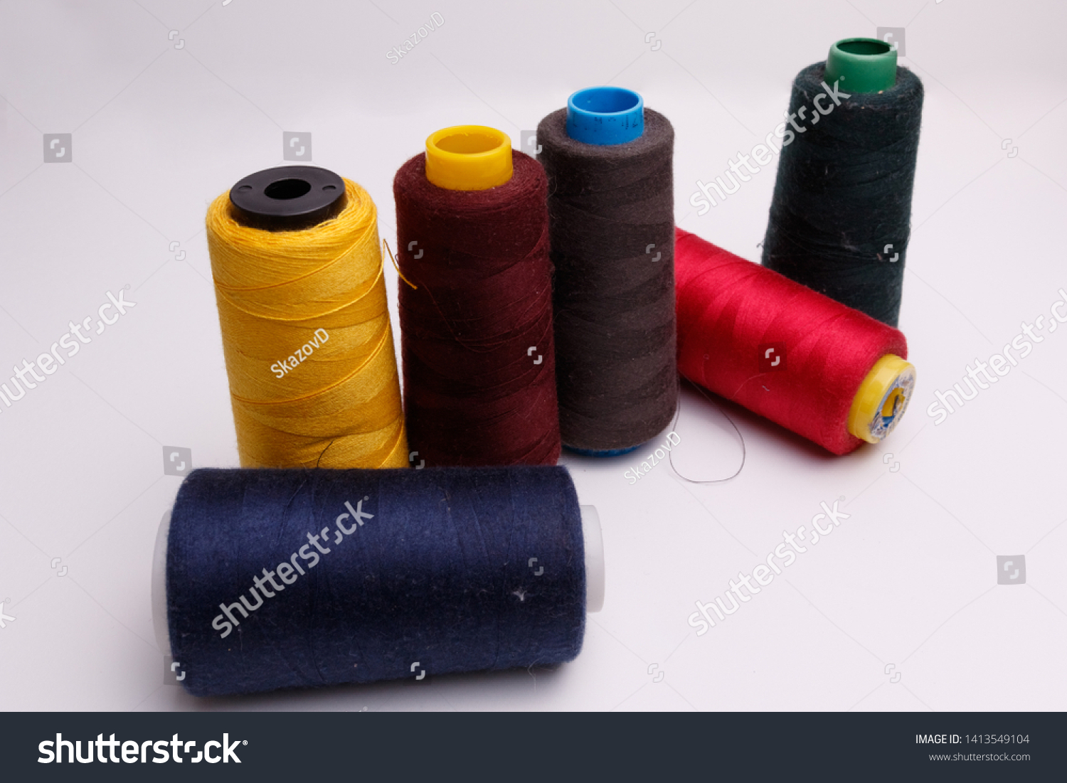 Colourful spools of thread on white background #1413549104