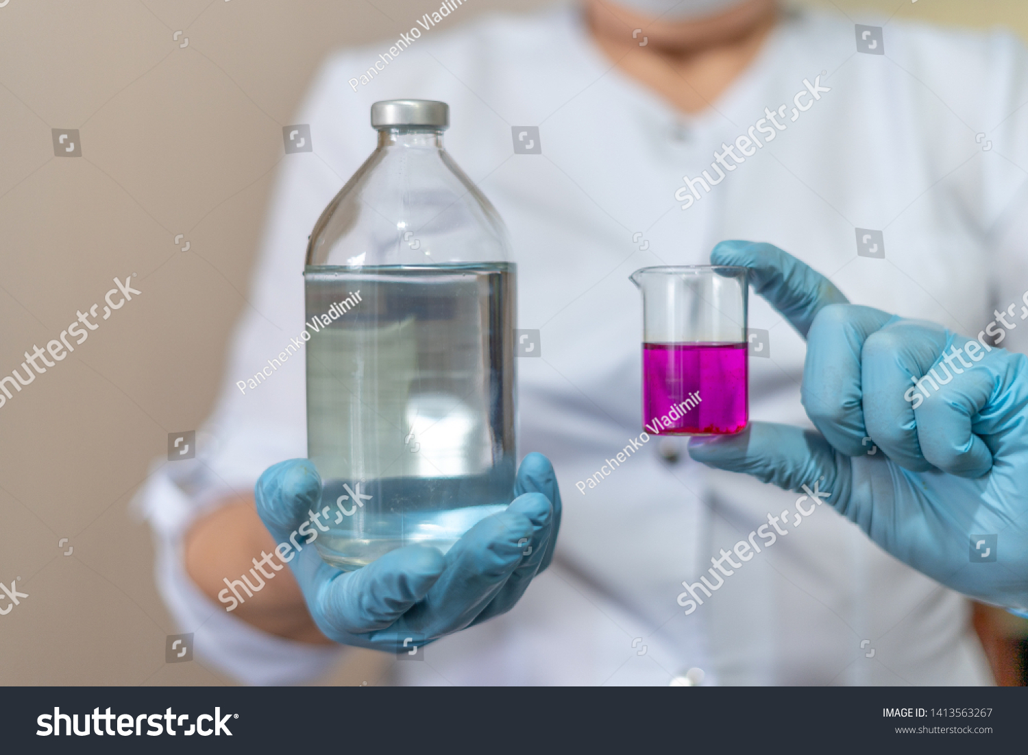 Doctor or scientist conducts experiments and presents vial liquid laboratory sample and contrasty potassium permanganate medical bottle. Pharmacy, science, research lab and healthcare concept. #1413563267