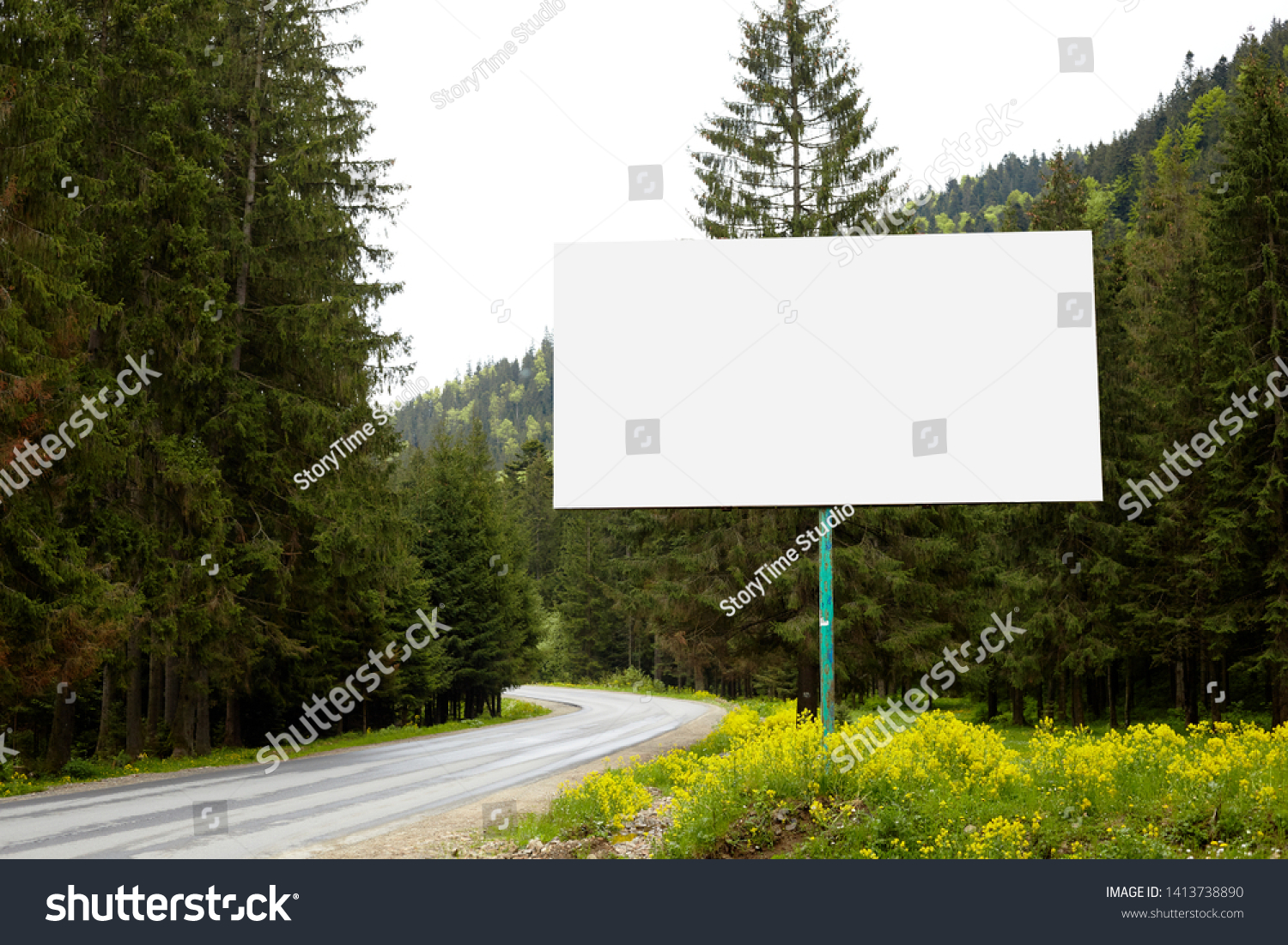 Empty billboard or big board on side of road with green forest and hills on background. Advertising blank, mock up, copy space for your advertisment or promotion text, Concept of advt and trading. #1413738890