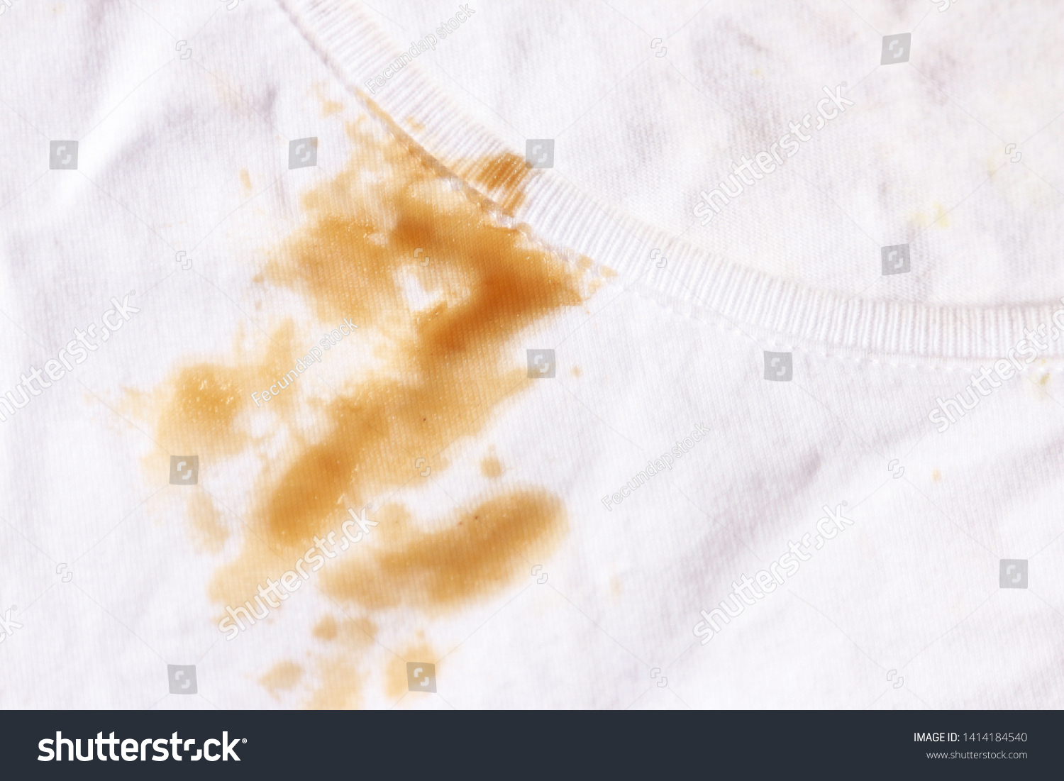 Dirty sauce stain on fabric from accident in daily life. dirt stains for cleaning work house  #1414184540