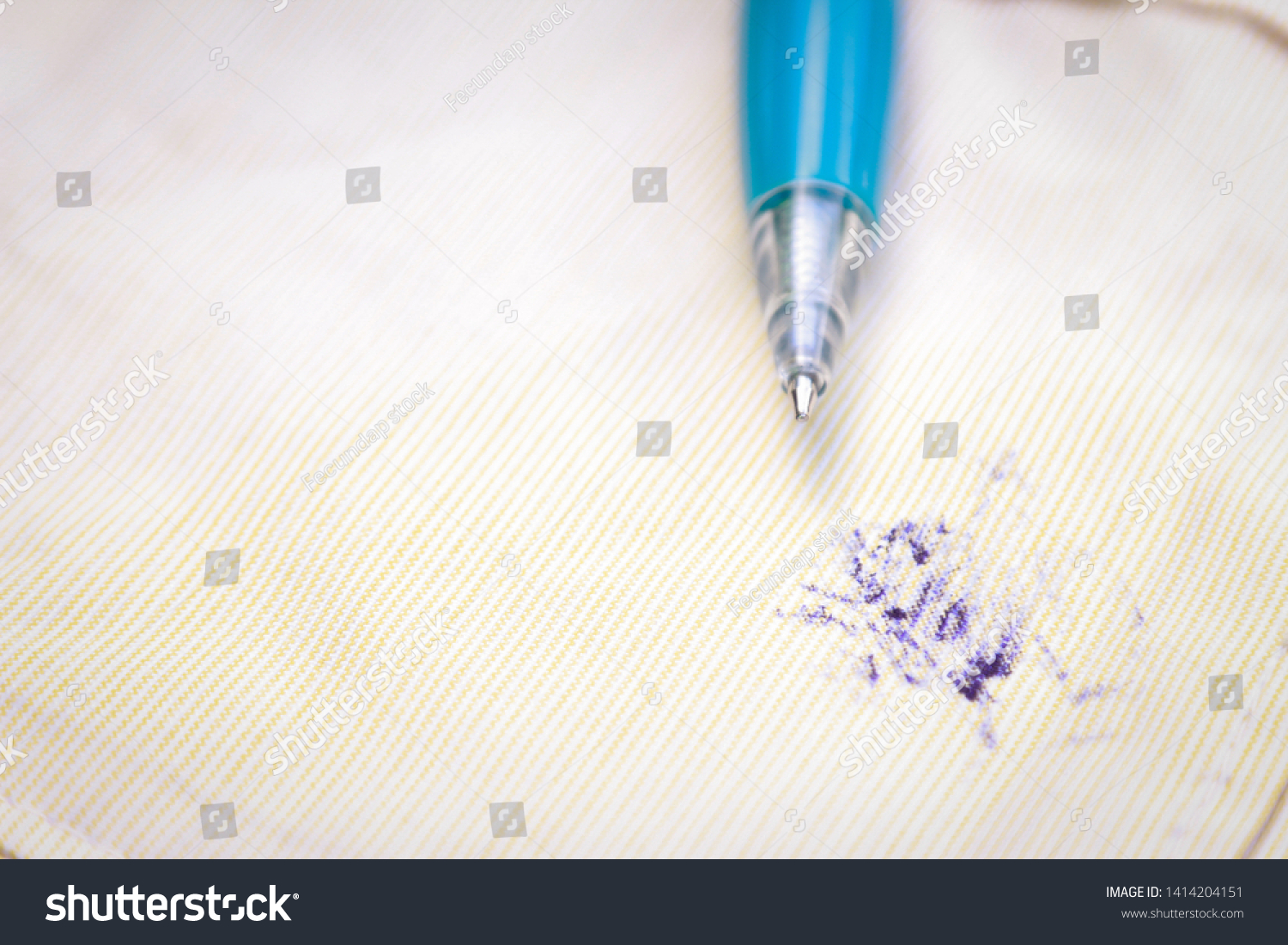 Dirty ink pen stain on fabric from accident in daily life. dirt stains for cleaning work house  #1414204151