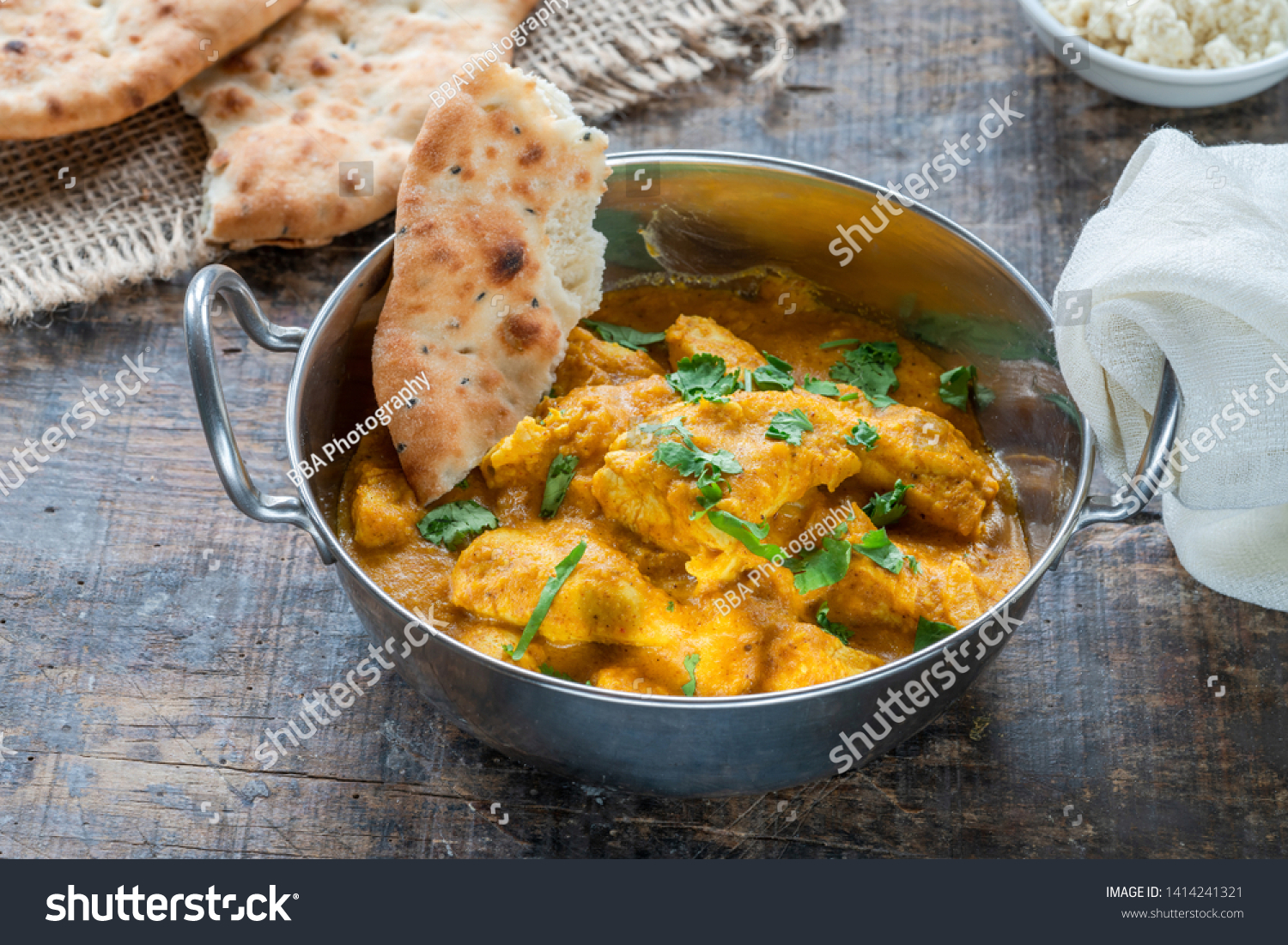 Chicken korma curry with naan bread - high angle view #1414241321
