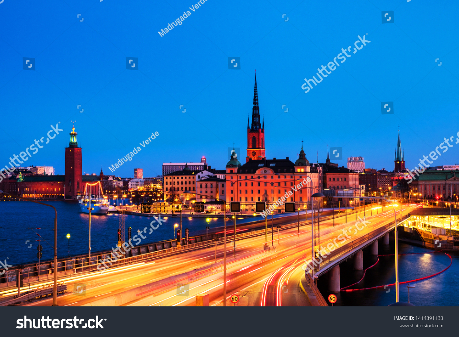Stockholm, Sweden. View of Gamla Stan in Stockholm, Sweden with landmarks like Riddarholm Church during the night. View of old buildings and car traffic at the bridge #1414391138