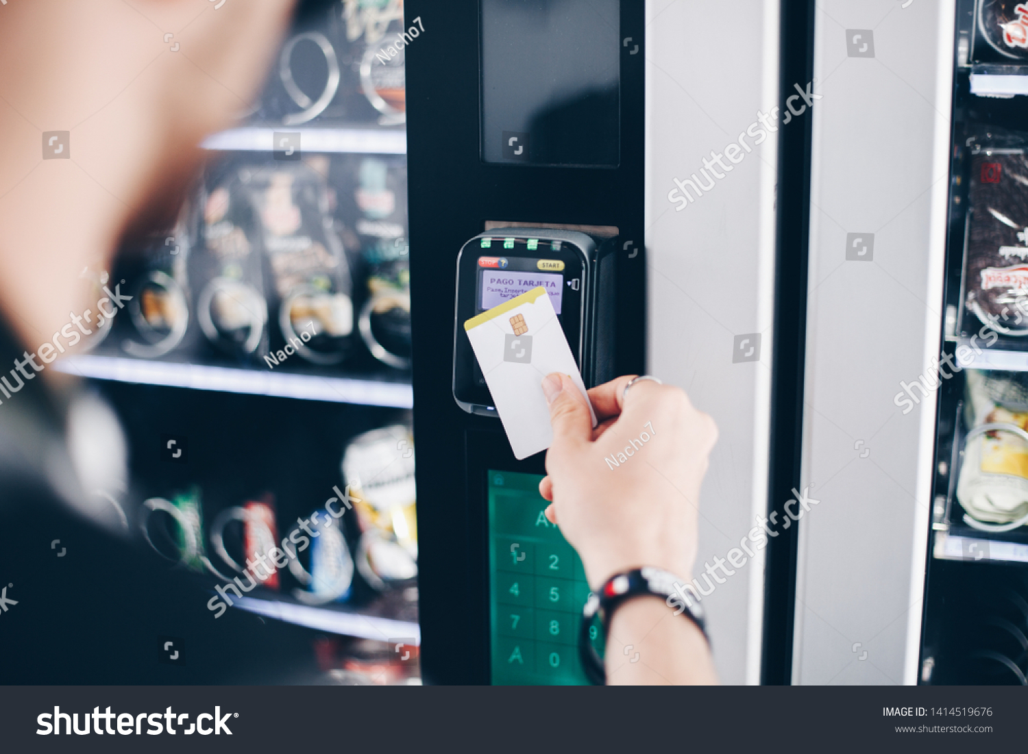 Student using the contactless payment method in a vending machine. #1414519676