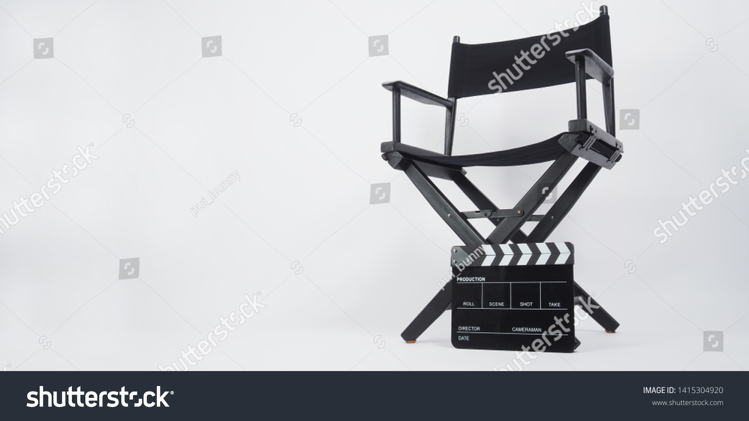 Black Clapper board or movie slate with director chair use in video production or movie and cinema industry. It's put on white background.
. #1415304920