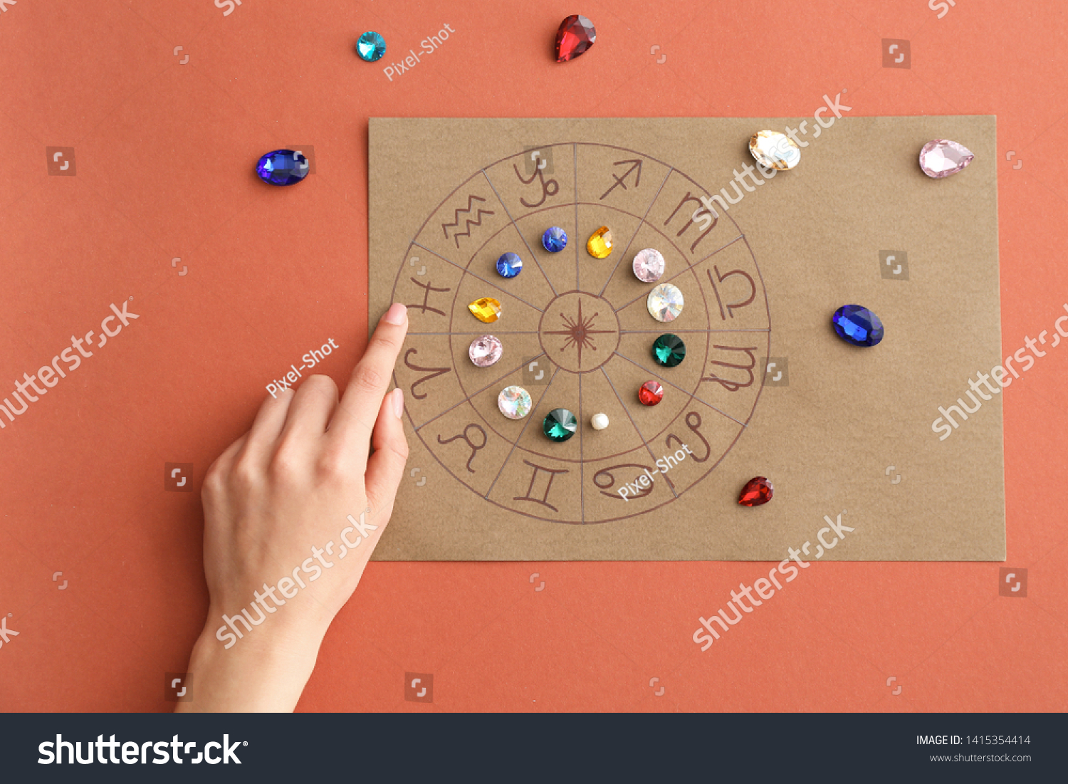 Astrological horoscope with birthstones and female hand on color background #1415354414