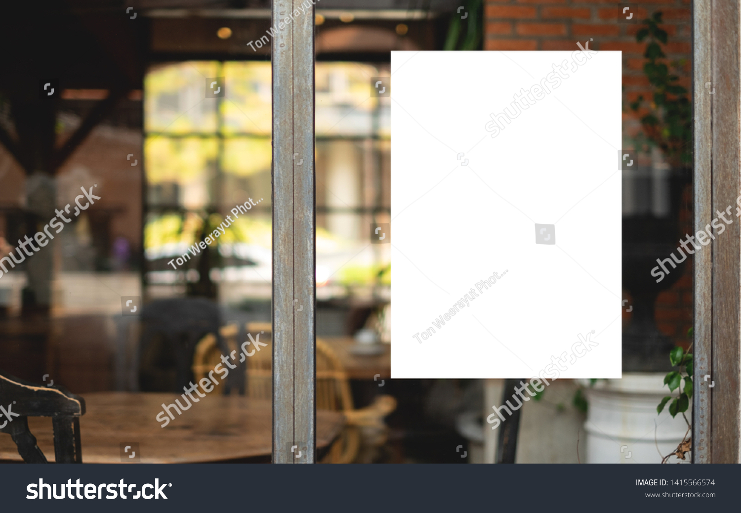 White paper poster mockup displayed outside the building restaurant. Marketing and business concept.  #1415566574