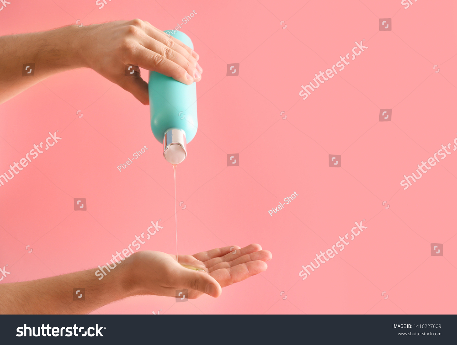 Male hands with bottle of shampoo on color background #1416227609