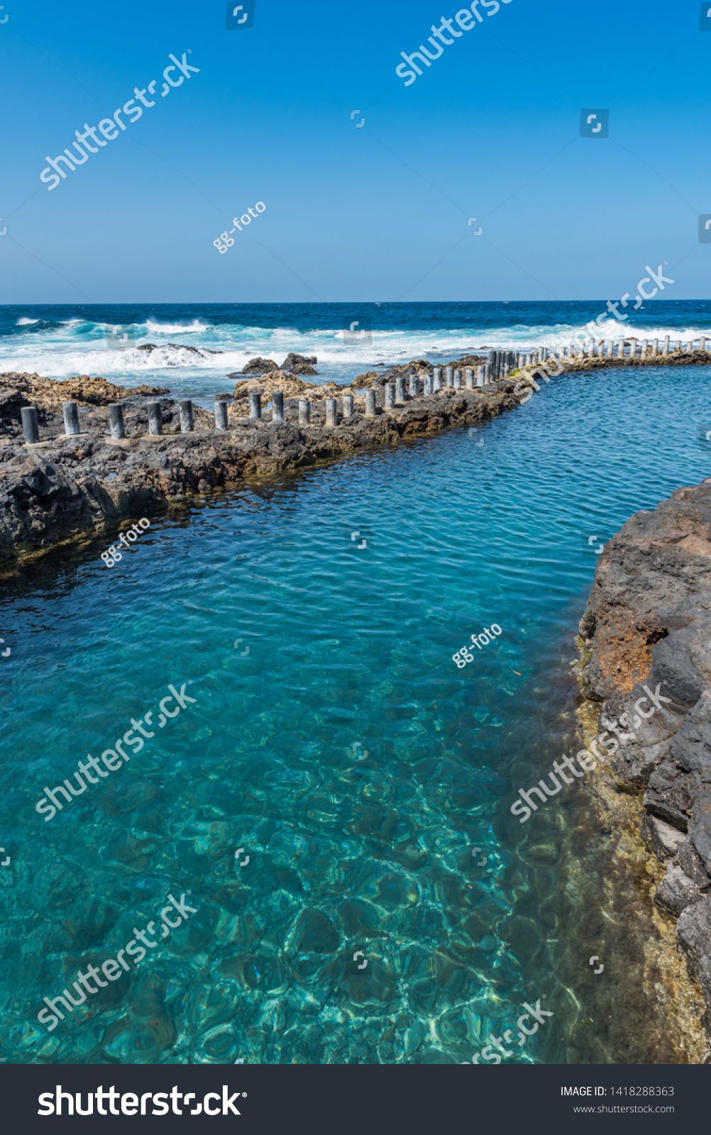 Natural pool Las Salinas de Agaete in Puerto de Las Nieves, Gran Canaria, Spain. Copy space for text. Vertical                                             #1418288363