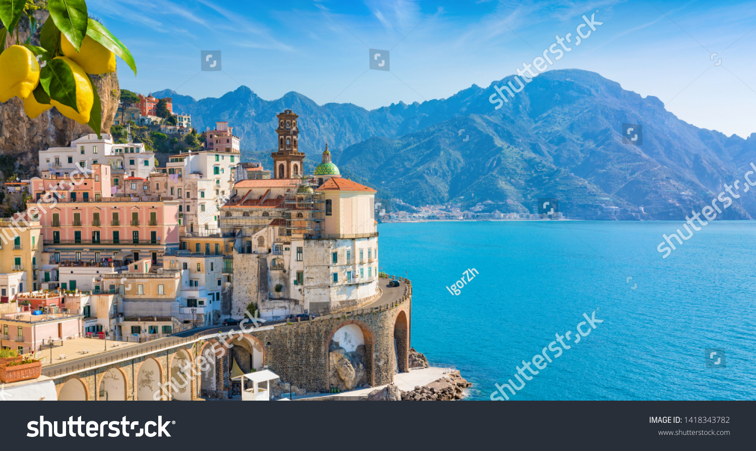Small town Atrani on Amalfi Coast in province of Salerno, Campania region, Italy. Amalfi coast is popular travel and holyday destination in Italy. Ripe yellow lemons in foreground. #1418343782