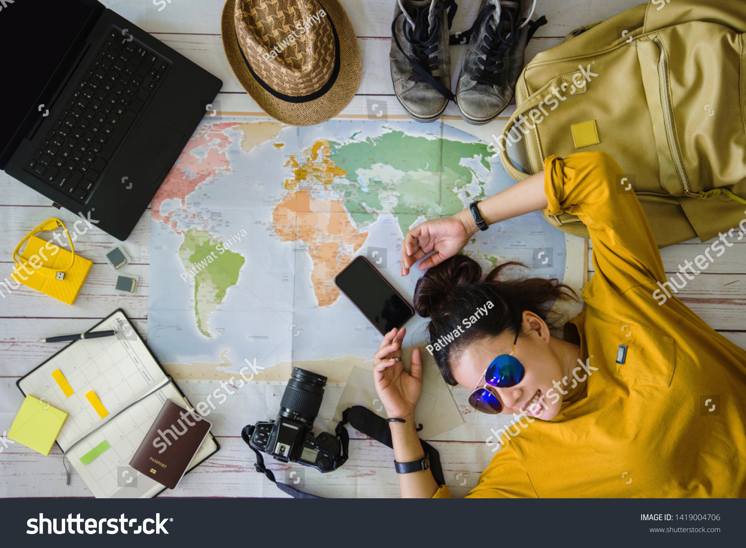 Travel planning concept with map. Overhead view of equipment for travelers. Background travel ideas young women sleeping smiling on the map. concept on vacation trip, map, Travel Thailand. #1419004706