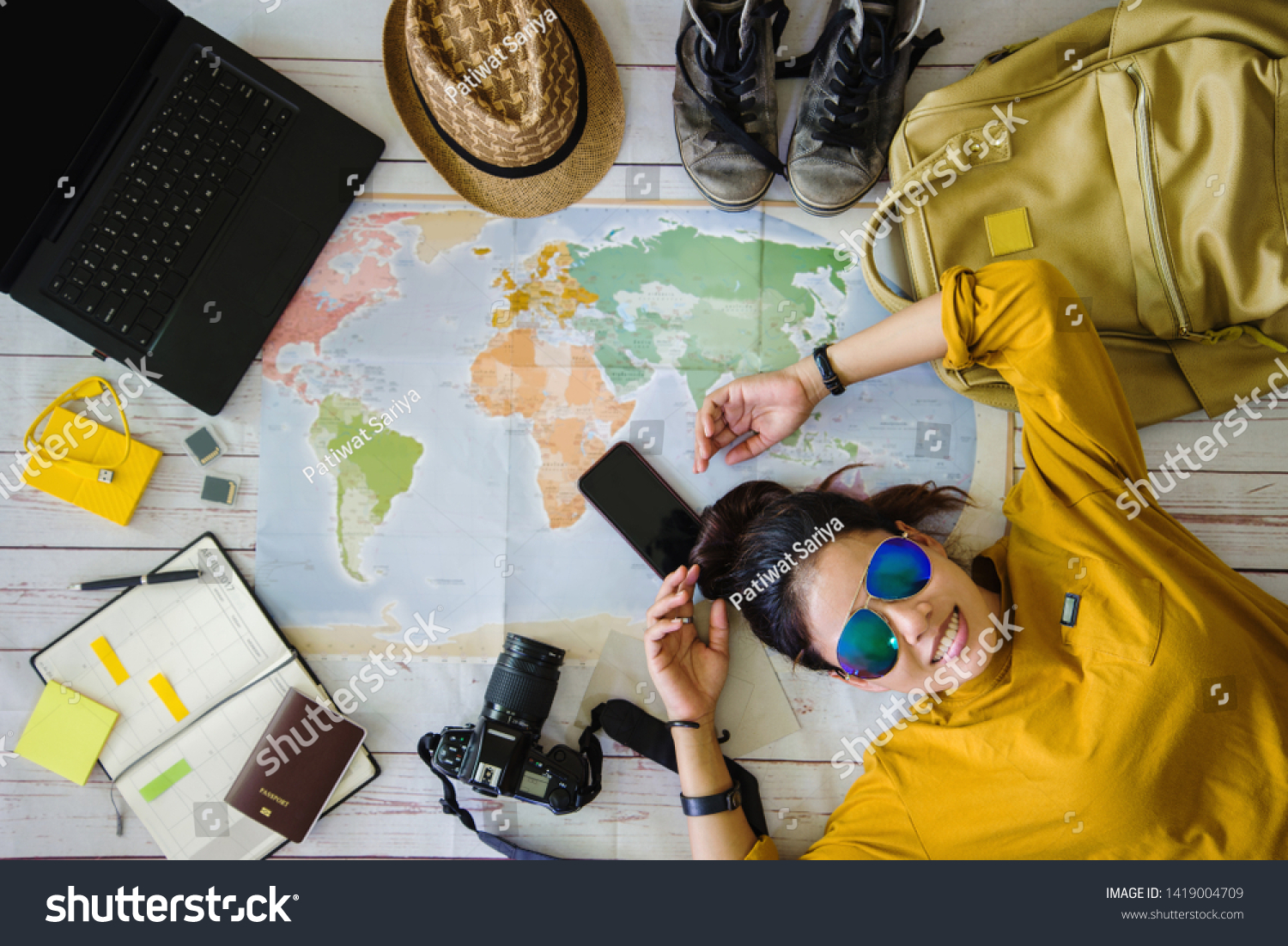 Travel planning concept with map. Overhead view of equipment for travelers. Background travel ideas young women sleeping smiling on the map. concept on vacation trip, map, Travel Thailand. #1419004709