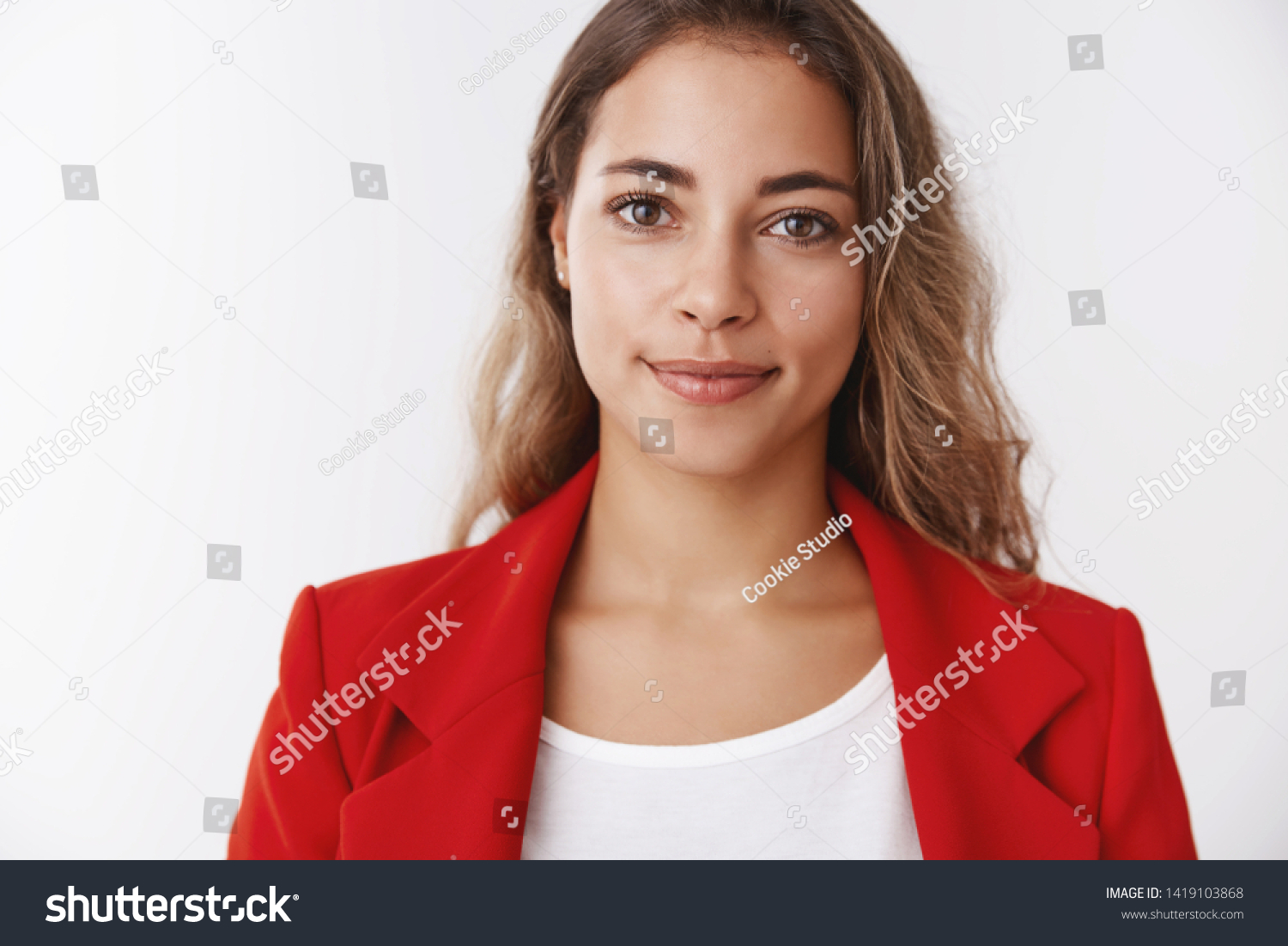 Portrait confident successful good-looking happy young curly-haired modern businesswoman wearing red jacket smiling self-assured expressing positive lucky vibe, grinning ambitious reach goal #1419103868