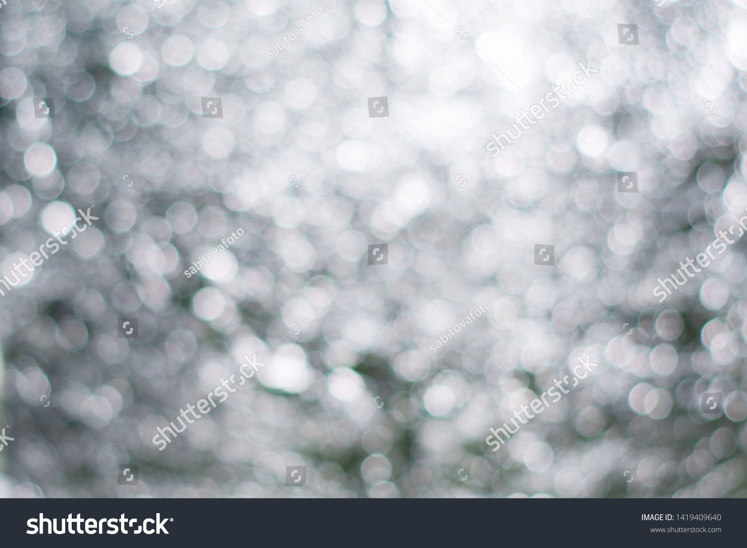 Blurred view of abstract silver background. Bokeh effect #1419409640