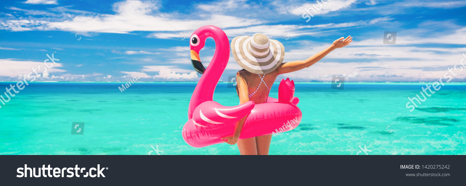 Happy summer vacation fun woman tourist enjoying travel holidays on beach banner background ready for swimming pool with flamingo float - funny holiday concept. #1420275242