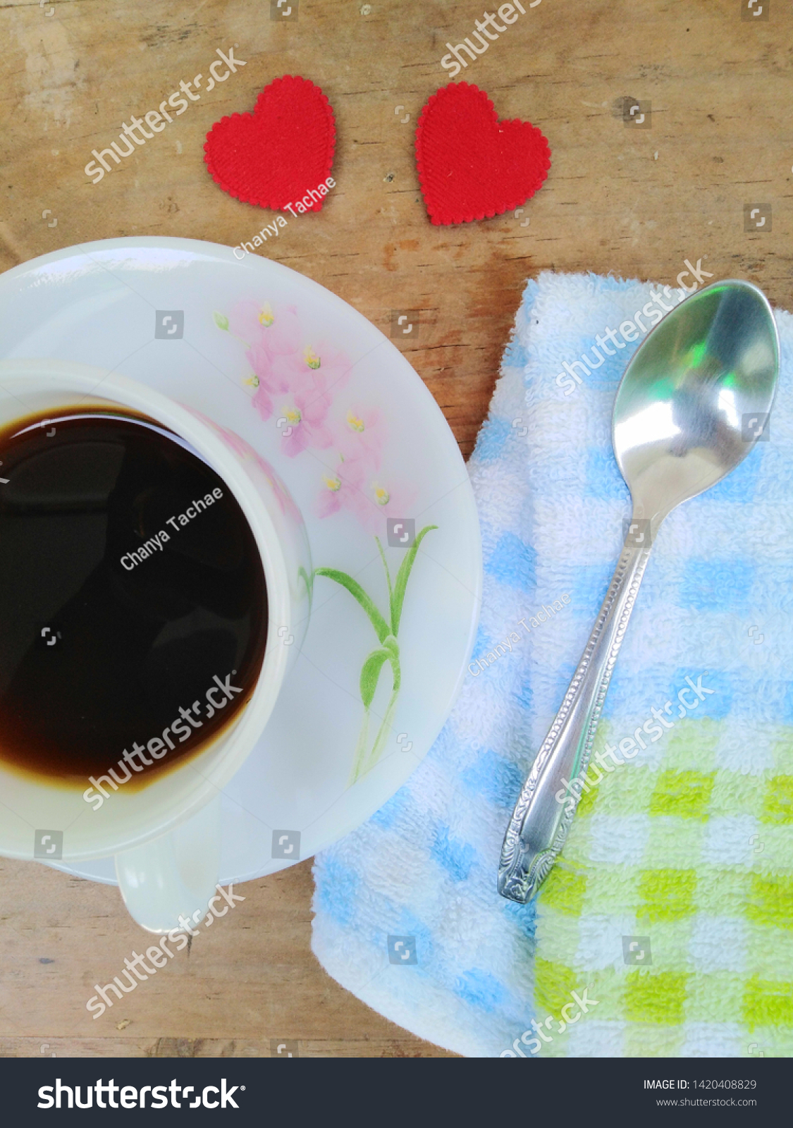 Black coffee in a white glass cup, coffee beans  #1420408829