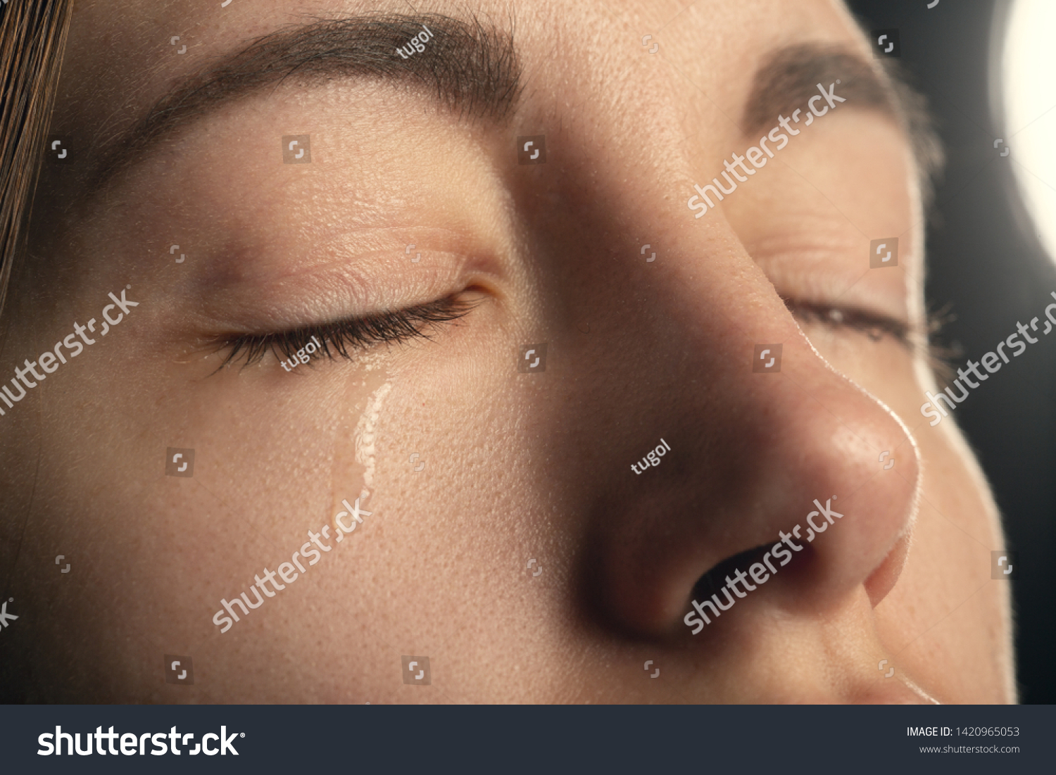 sad sad woman crying, closed eyes, closeup portrait #1420965053