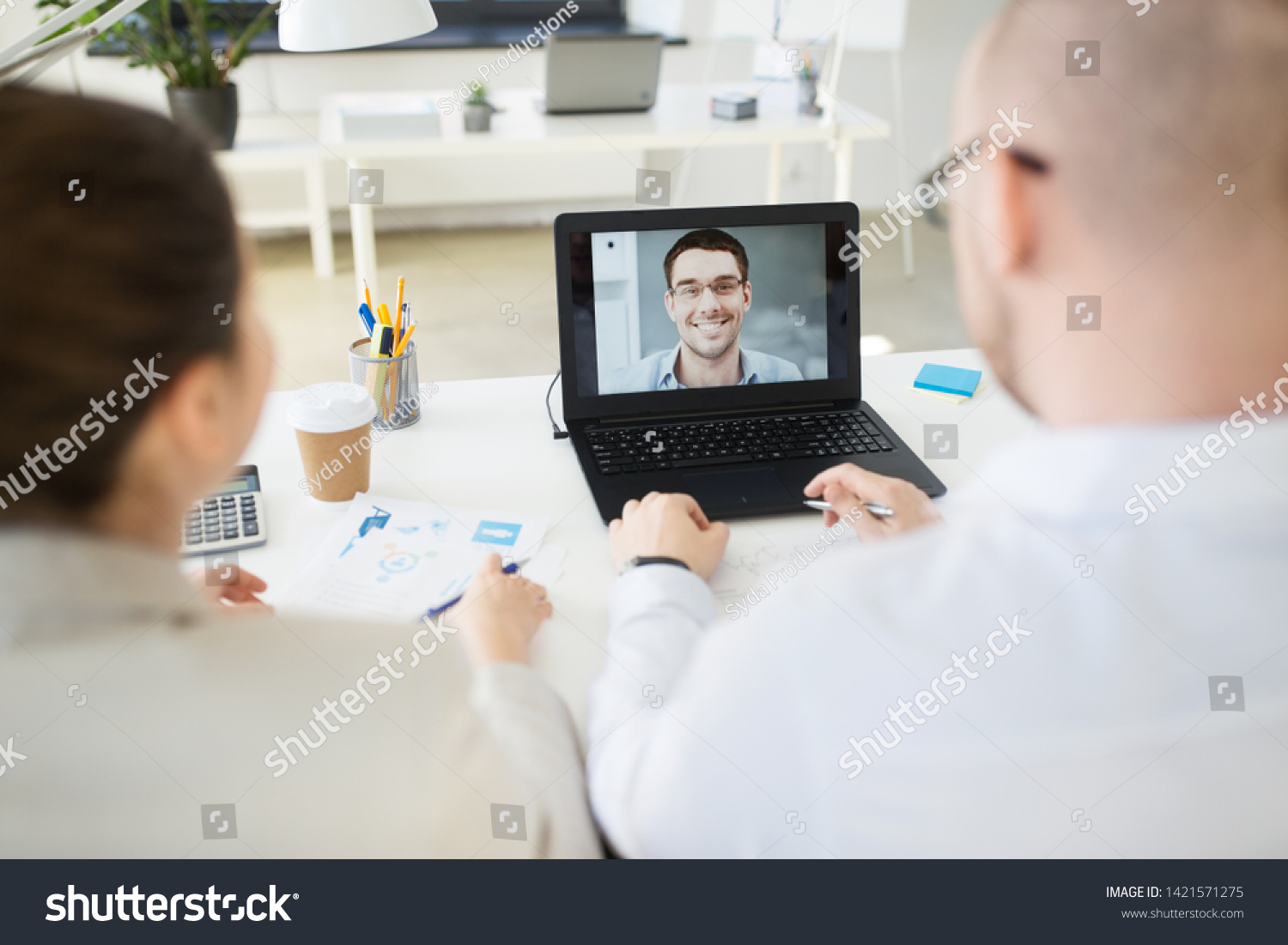 business, employment and technology concept - team of employers having video conference or job interview with new employee at office #1421571275